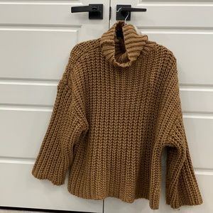 Oversized brown knit turtle neck sweater